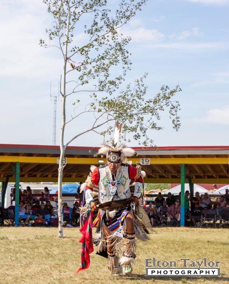 Wyatt Brown in full Indigenous Dress during a Powwow