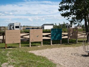 FAQ 7 interactive signs at the playground at Sunset Beach at Lake Diefenbaker